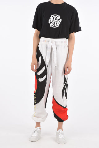 PYER MOSS Joggers SANKOFA con Stampe