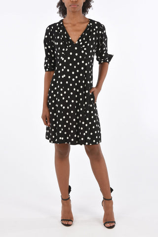 vestito a pois scollo a v con manica bombata