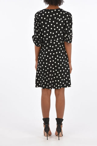 vestito a pois scollo a v con manica bombata