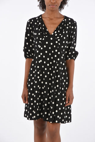 vestito a pois scollo a v con manica bombata