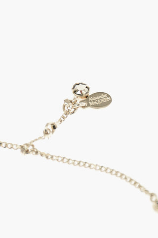 metal bracelet with skull charm